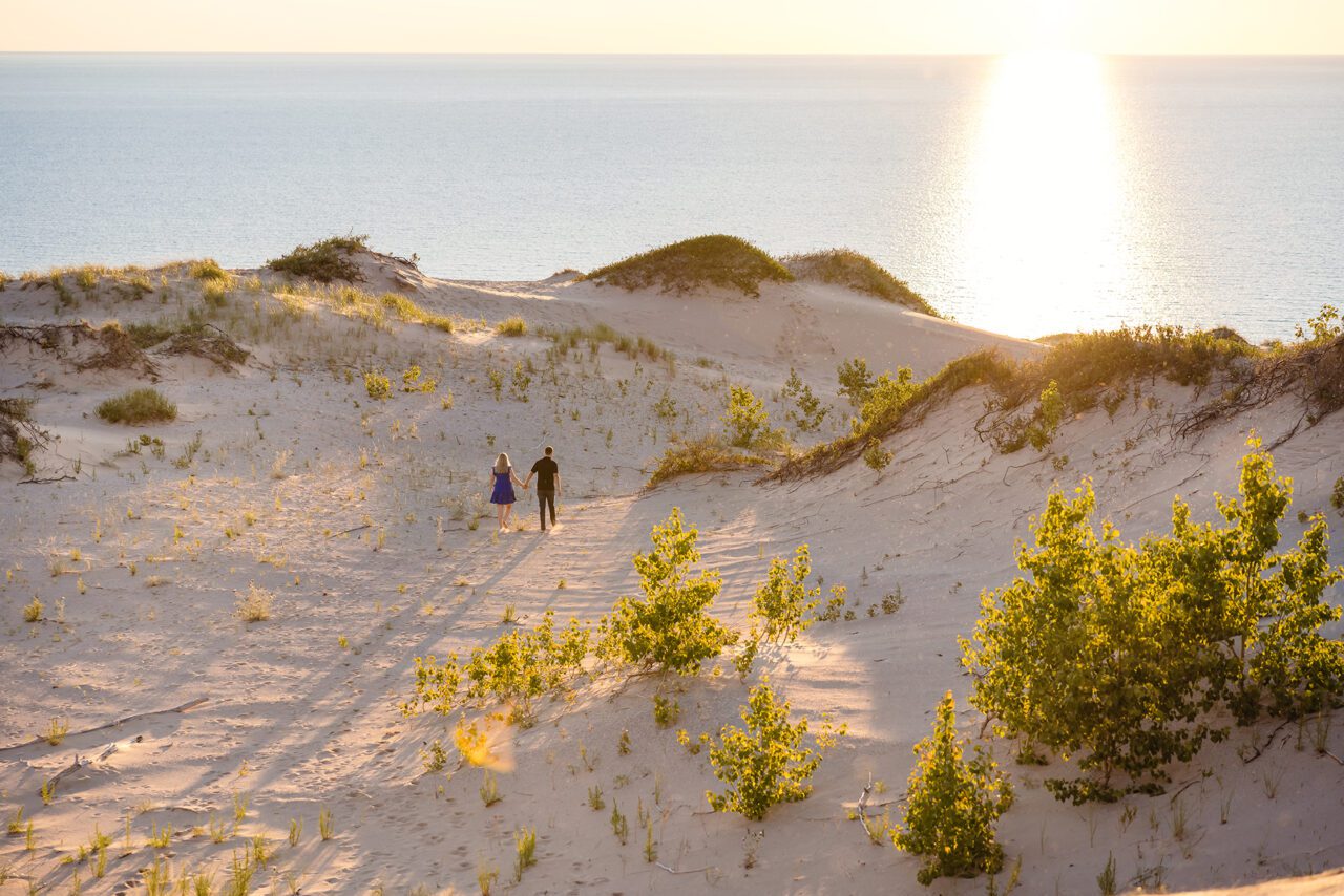 sunset engagement photo in sleeping bear dunes on Lake Michigan