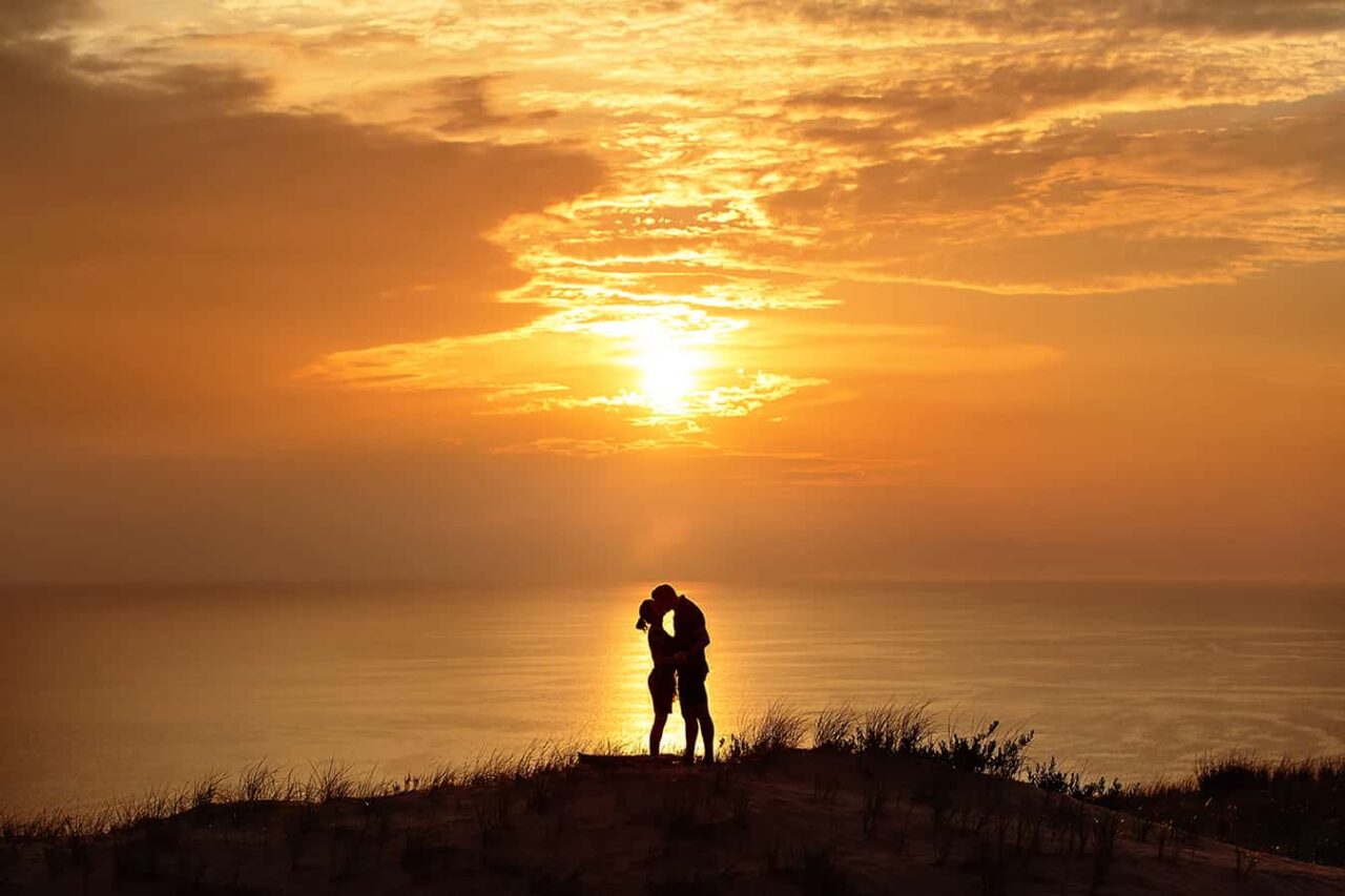 sunset engagement photo in sand dunes