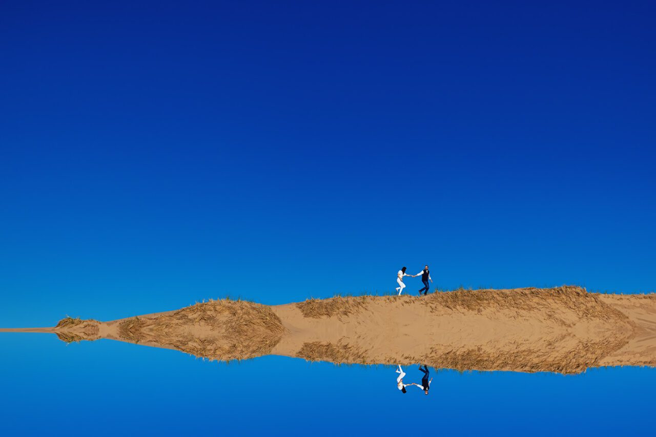 Sand Dune Engagement photos with blue sky