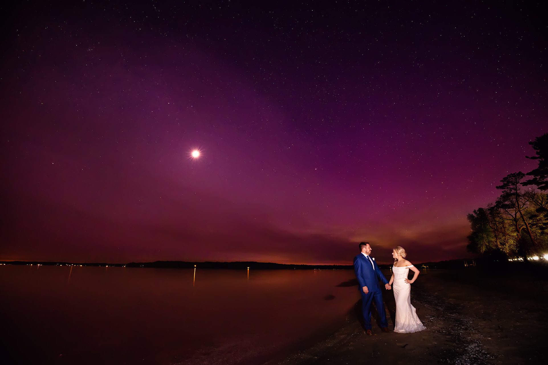 bride and groom watching northern light at the peninsula room on old mission